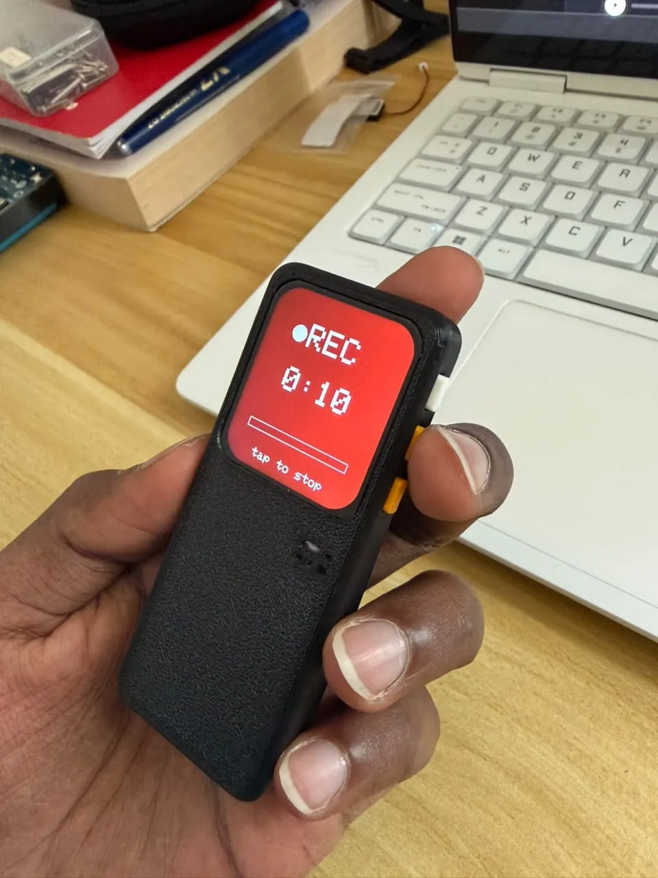 Blue in hand, recording, with a red screen showing a timer