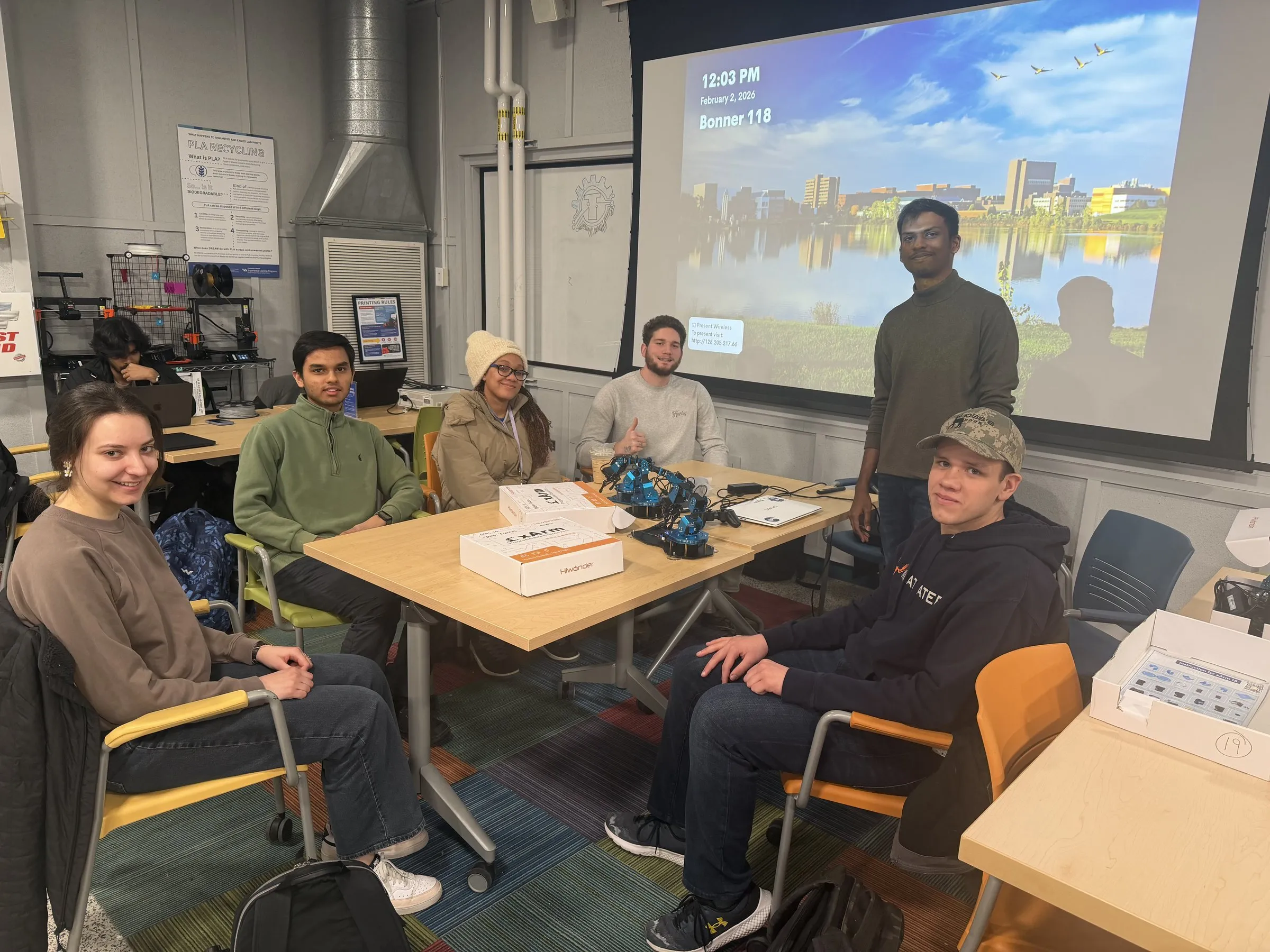 Kumar presenting to students at a robotic-arm workshop in the DREAM Lab